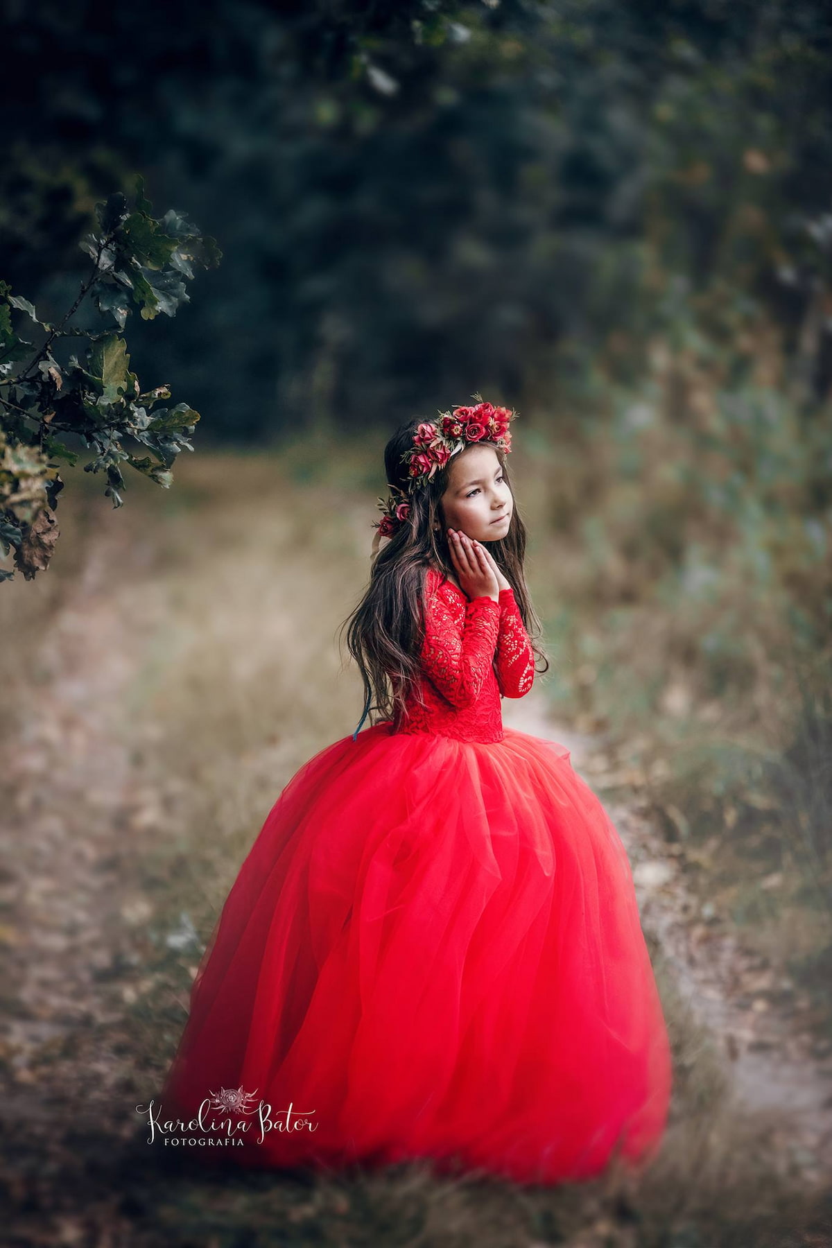 Girl in a voluminous tulle gown with floral crown in a woodland setting