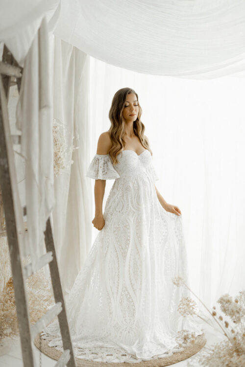 Boho lace dress in white ecru. This romantic maternity gown is designed especially for photographers and maternity sessions. The lightweight fabric drapes beautifully and creates a stunning effect in motion.