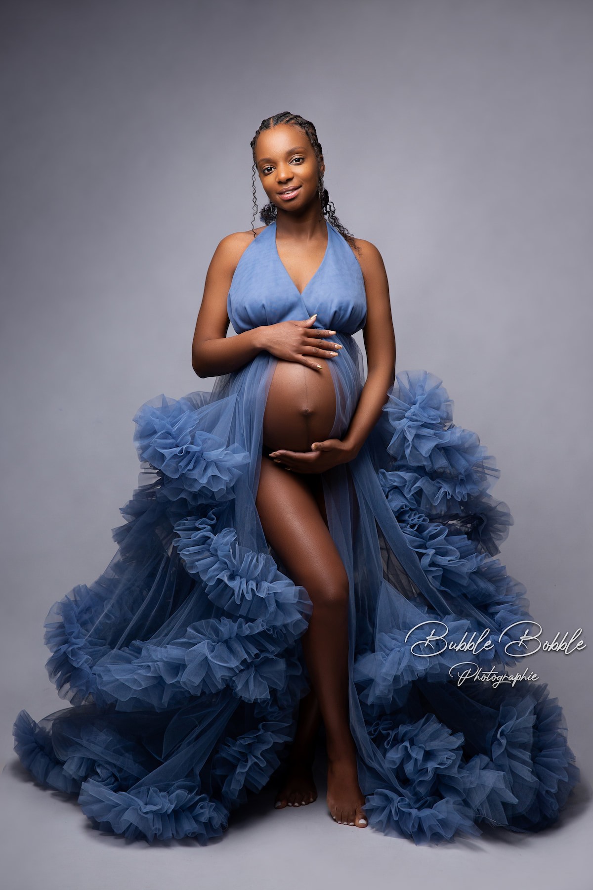 Denim blue Rumba maternity dress with long tulle train, perfect for fine art and studio pregnancy photoshoots.