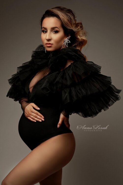 Dramatic maternity photoshoot with black tulle ruffle top