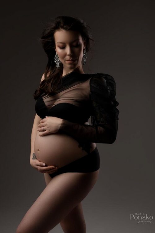 Black tulle maternity top with modern asymmetrical cut