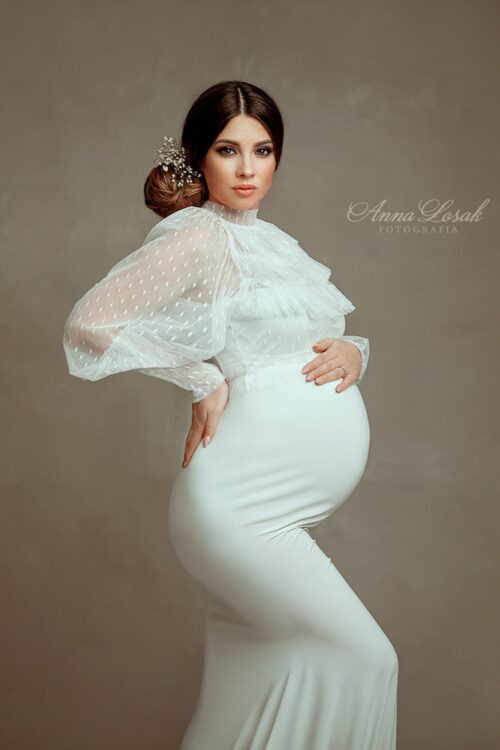 Fine art maternity portrait with transparent dotted tulle top