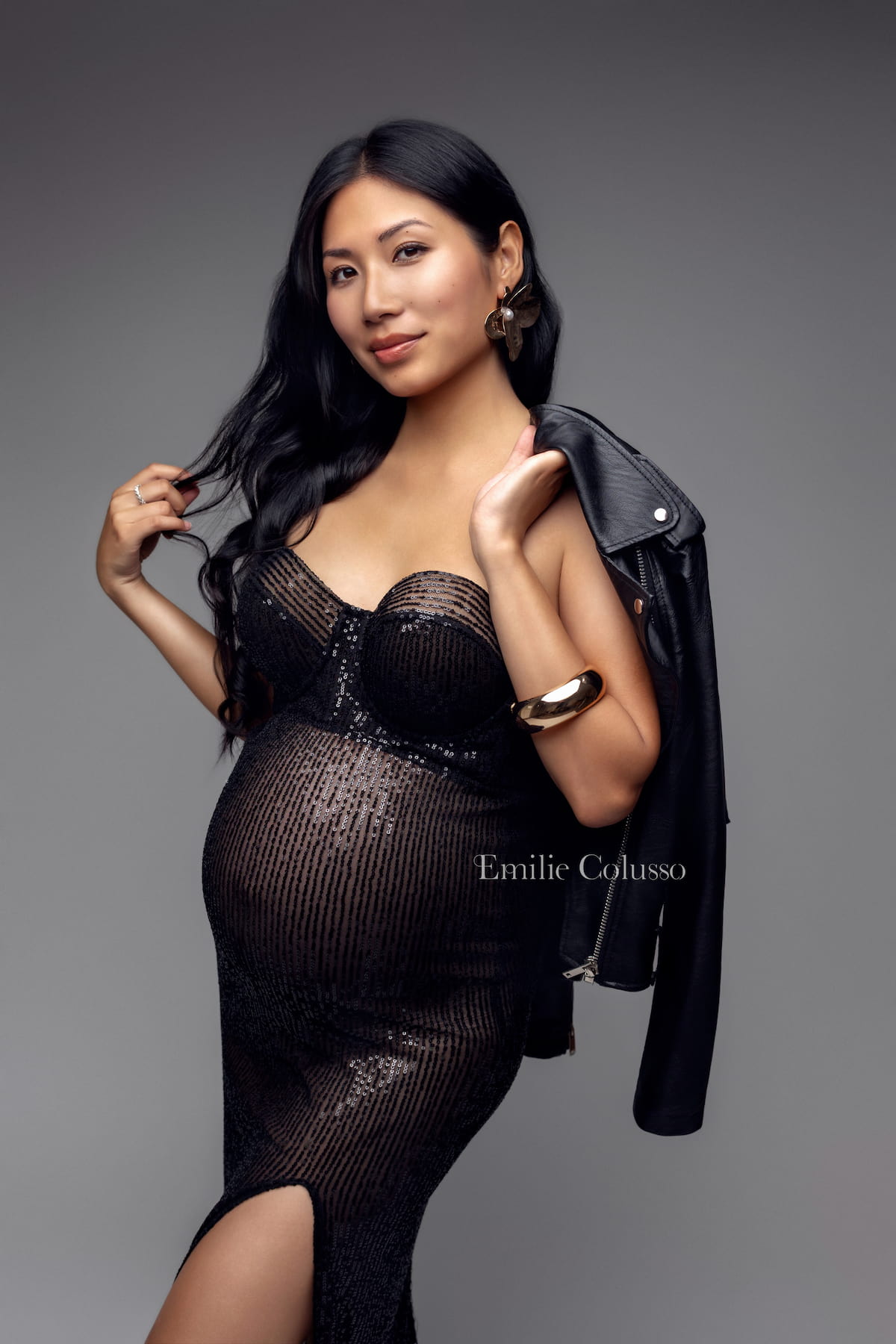 Black maternity dress Desire with sequin details and thigh-high slit for elegant maternity photoshoot